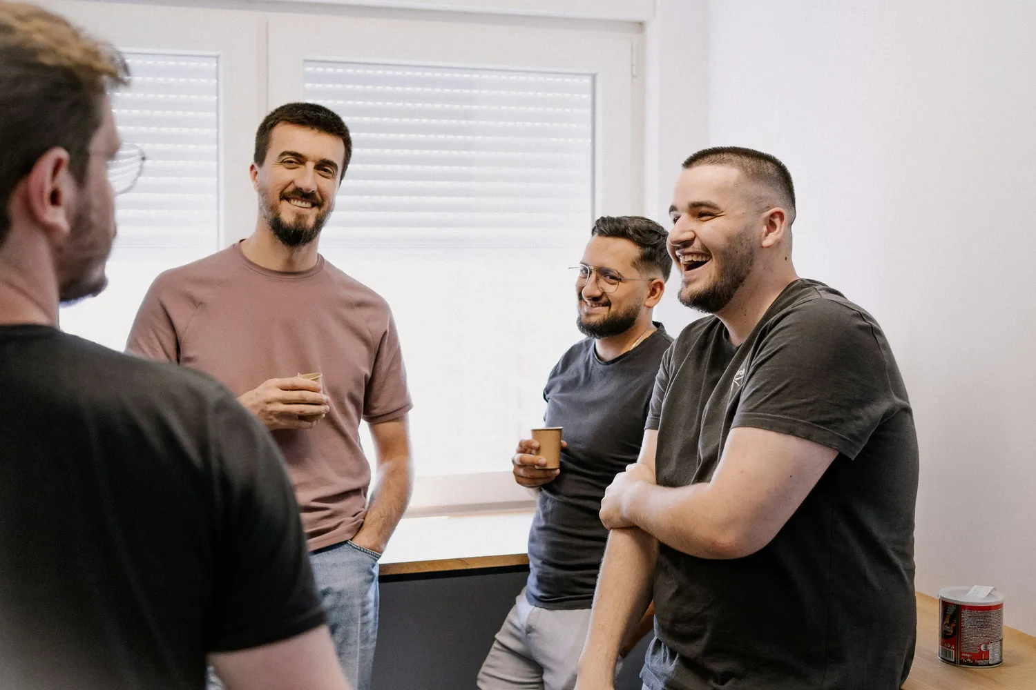 Group of men sitting together in a support group setting
