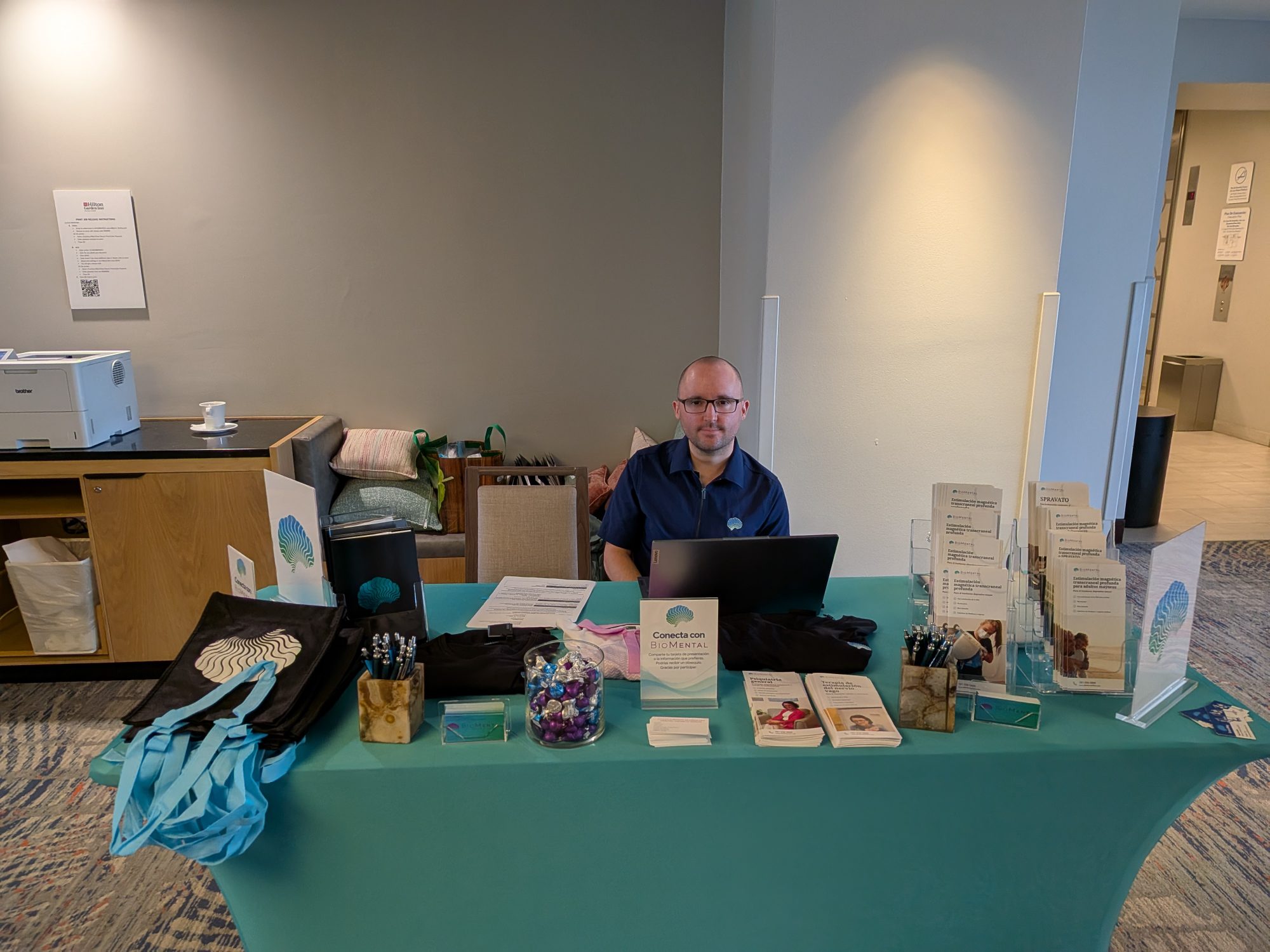 BioMental team member at the practice’s information booth during the summit